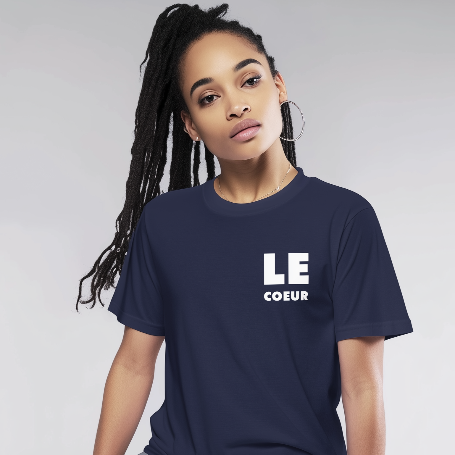 Person wearing a navy blue t-shirt with 'LE COEUR' text on a plain background